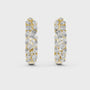 Pair of diamond earrings with gold and silver accents on a white background