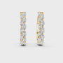Gold hoop earrings with diamonds on a white background