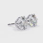 Pair of diamond stud earrings on a white background