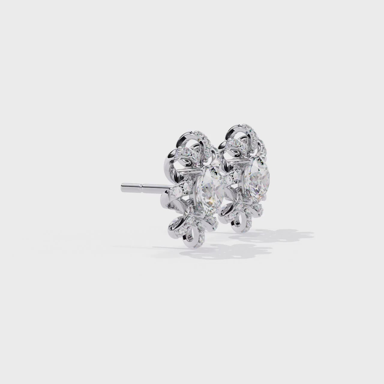 Gold and diamond earrings on a white background