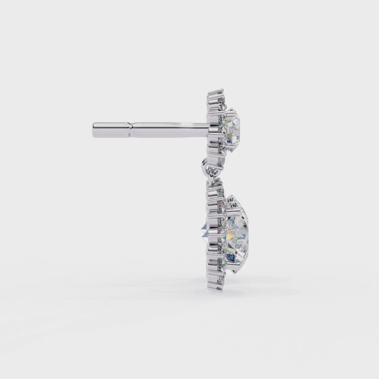 Pair of diamond earrings on a white background
