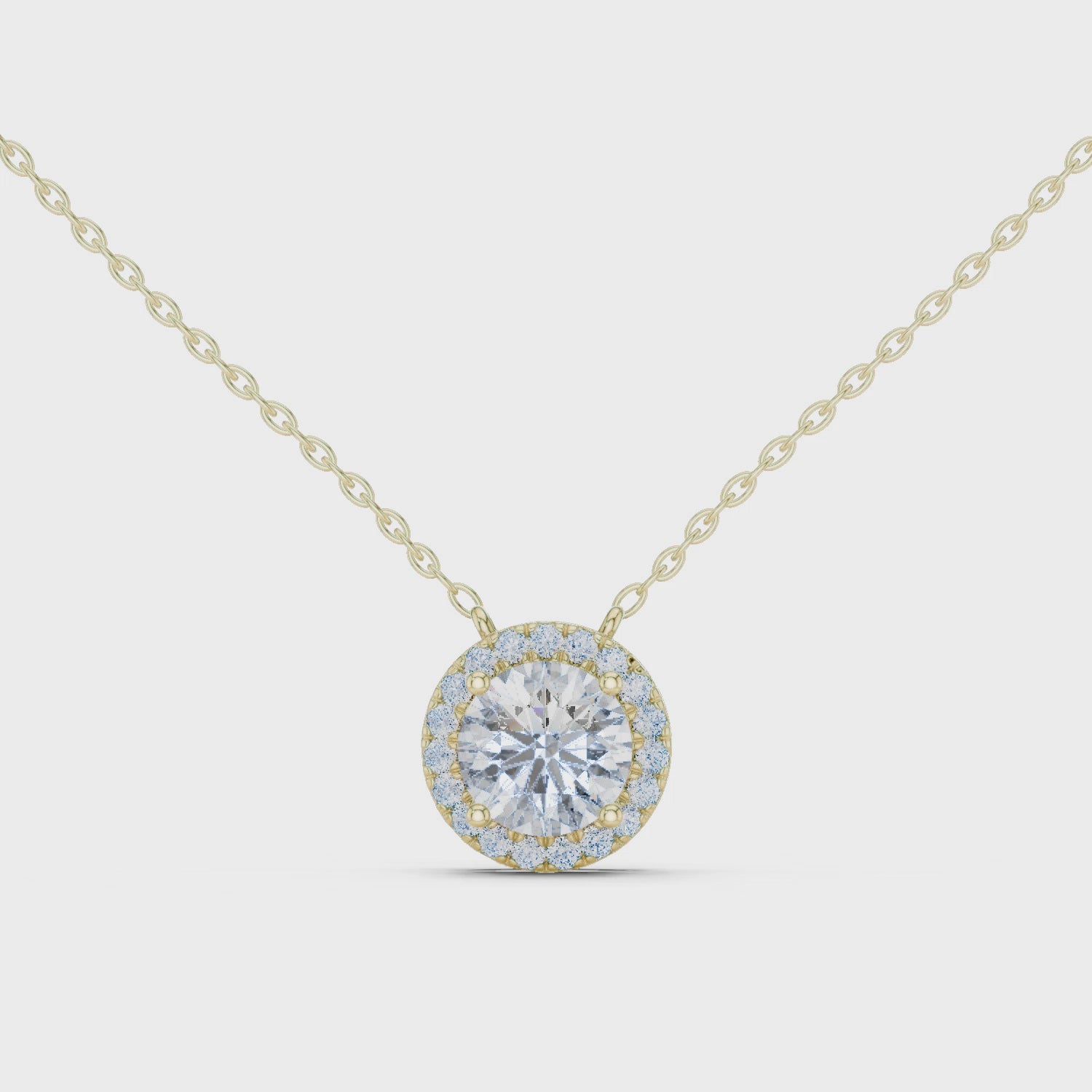 Gold necklace with a round diamond pendant on a white background