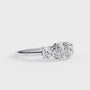 Cushion-cut solitaire flanked by two perfectly matched cushion-cut side stones