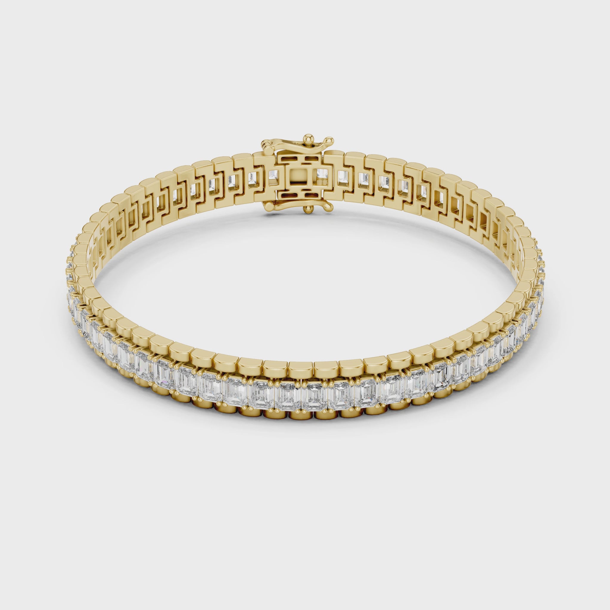 Modern Tennis Bracelet features Emerald-cut diamonds meticulously secured within a seamless 18K Gold channel