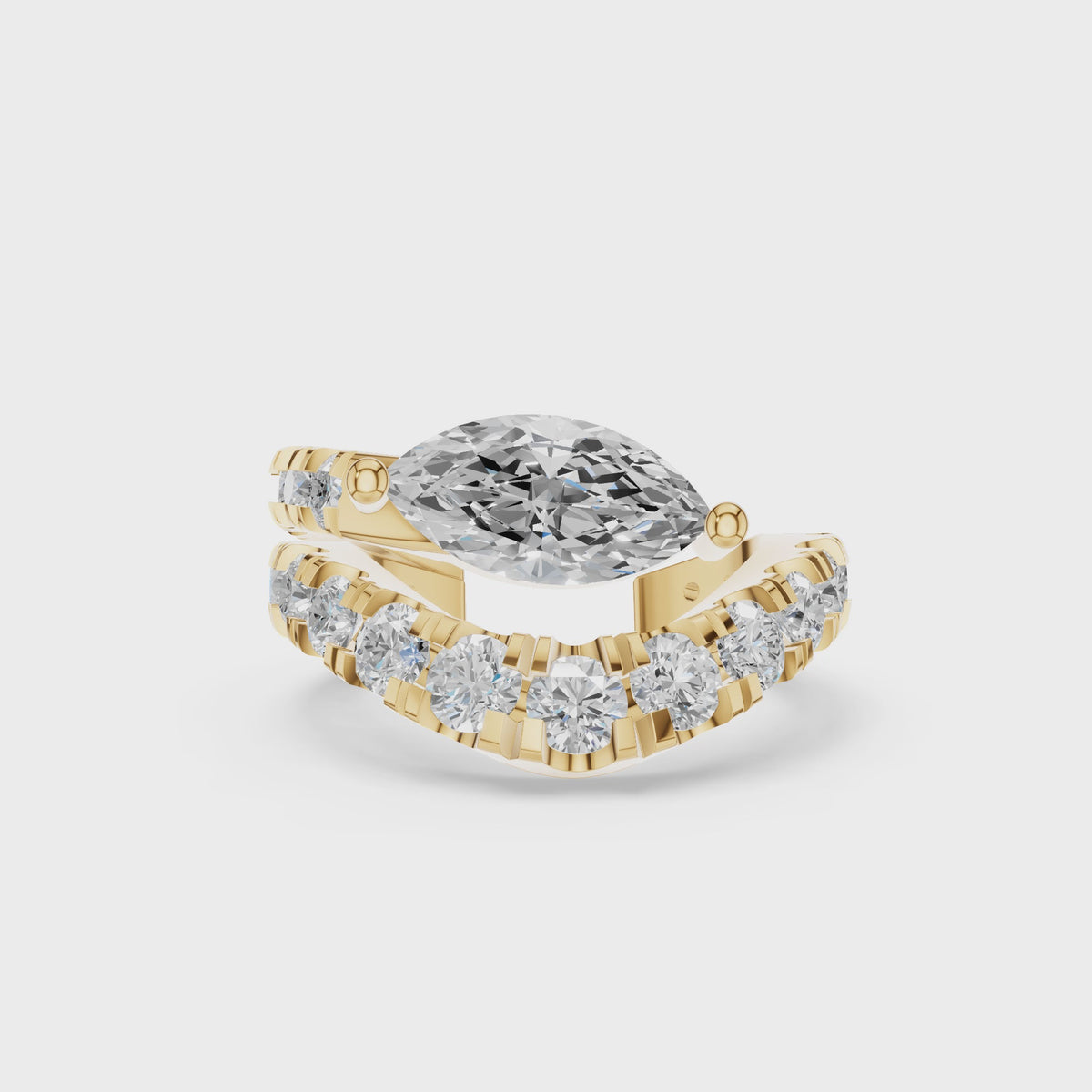 A single 0.46ct marquise diamond ear cuff surrounded by a graduated pavé halo, set in 14K yellow gold.