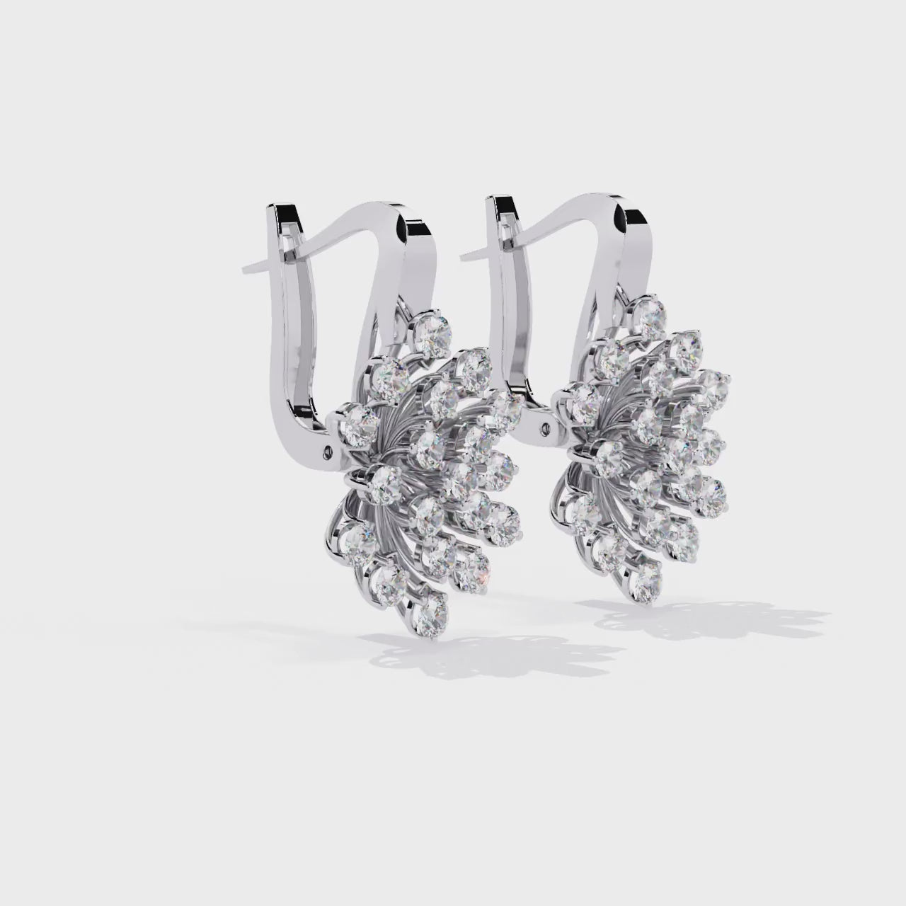 White Gold and diamond snowflake earrings on a white background