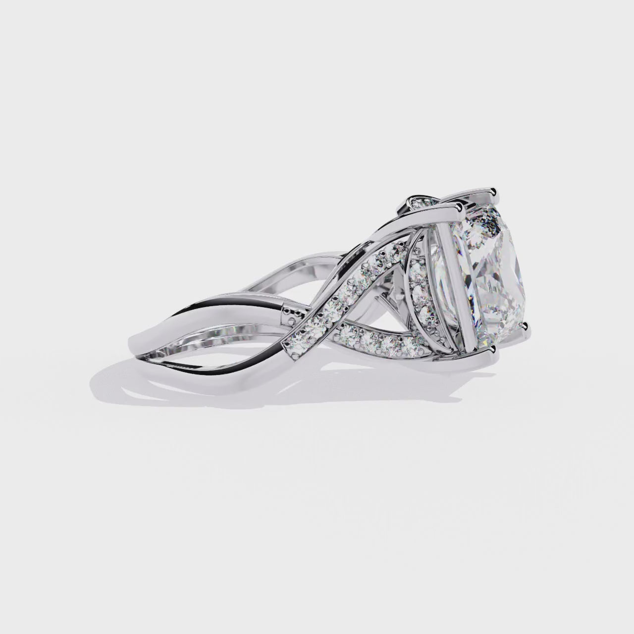 ring showcases a magnificent Princess-cut solitaire encircled by a shimmering Pavé halo