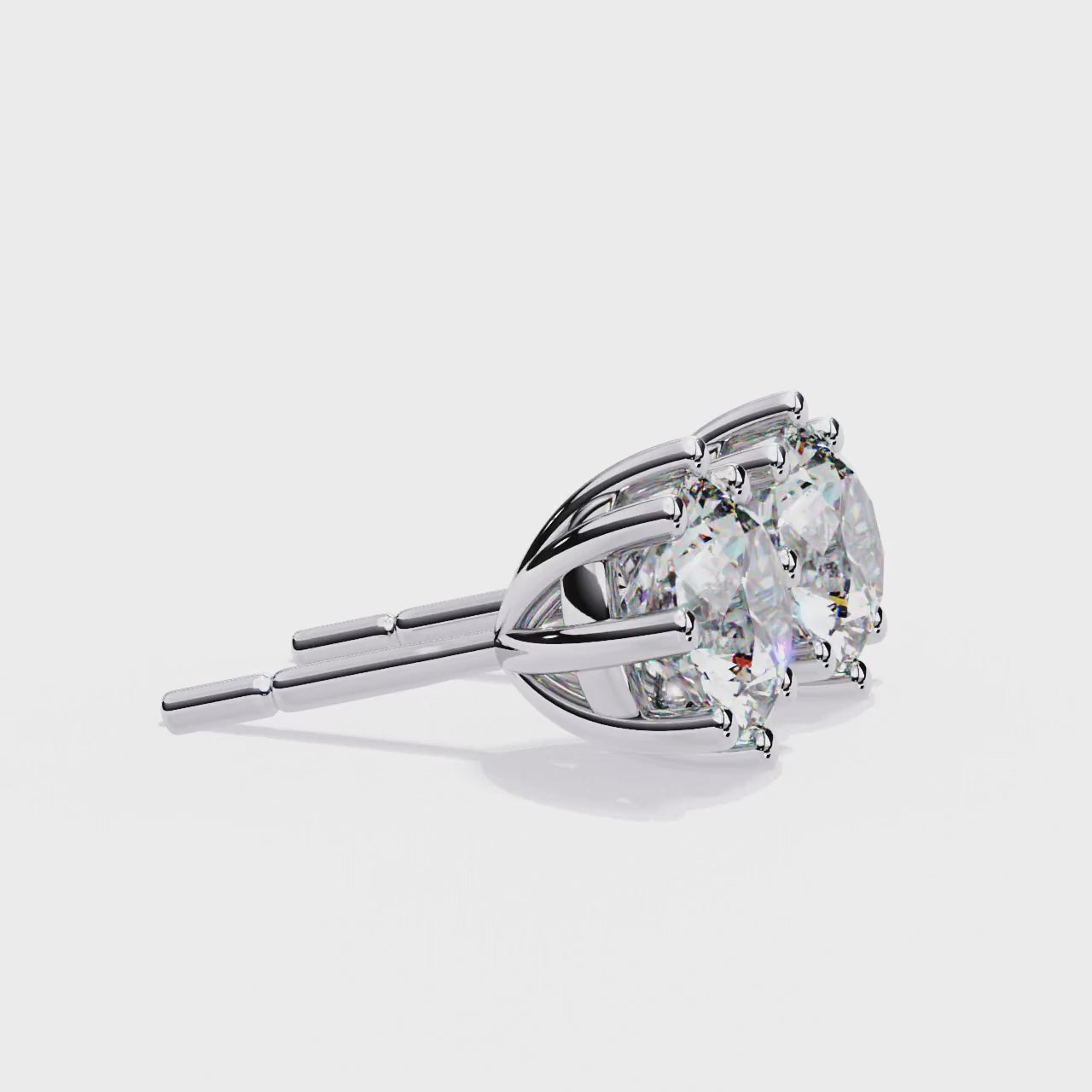 Pair of diamond stud earrings on a white background