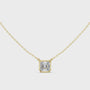Gold necklace with a diamond pendant on a white background