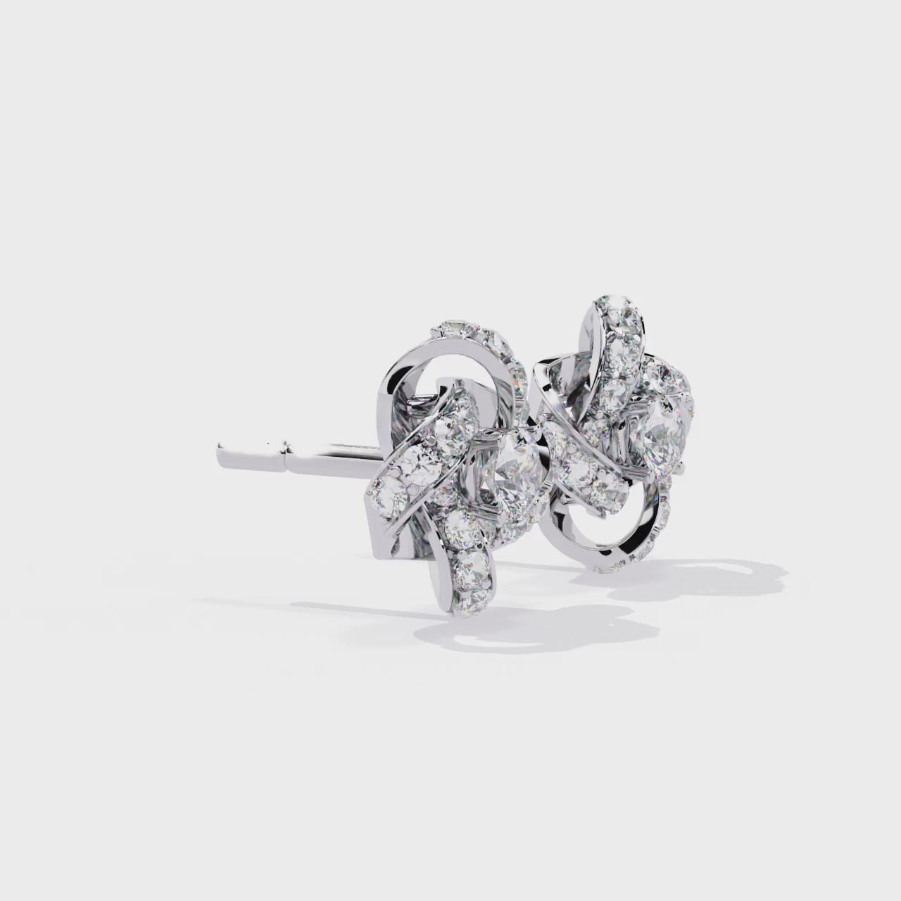 Pair of diamond earrings on a white background