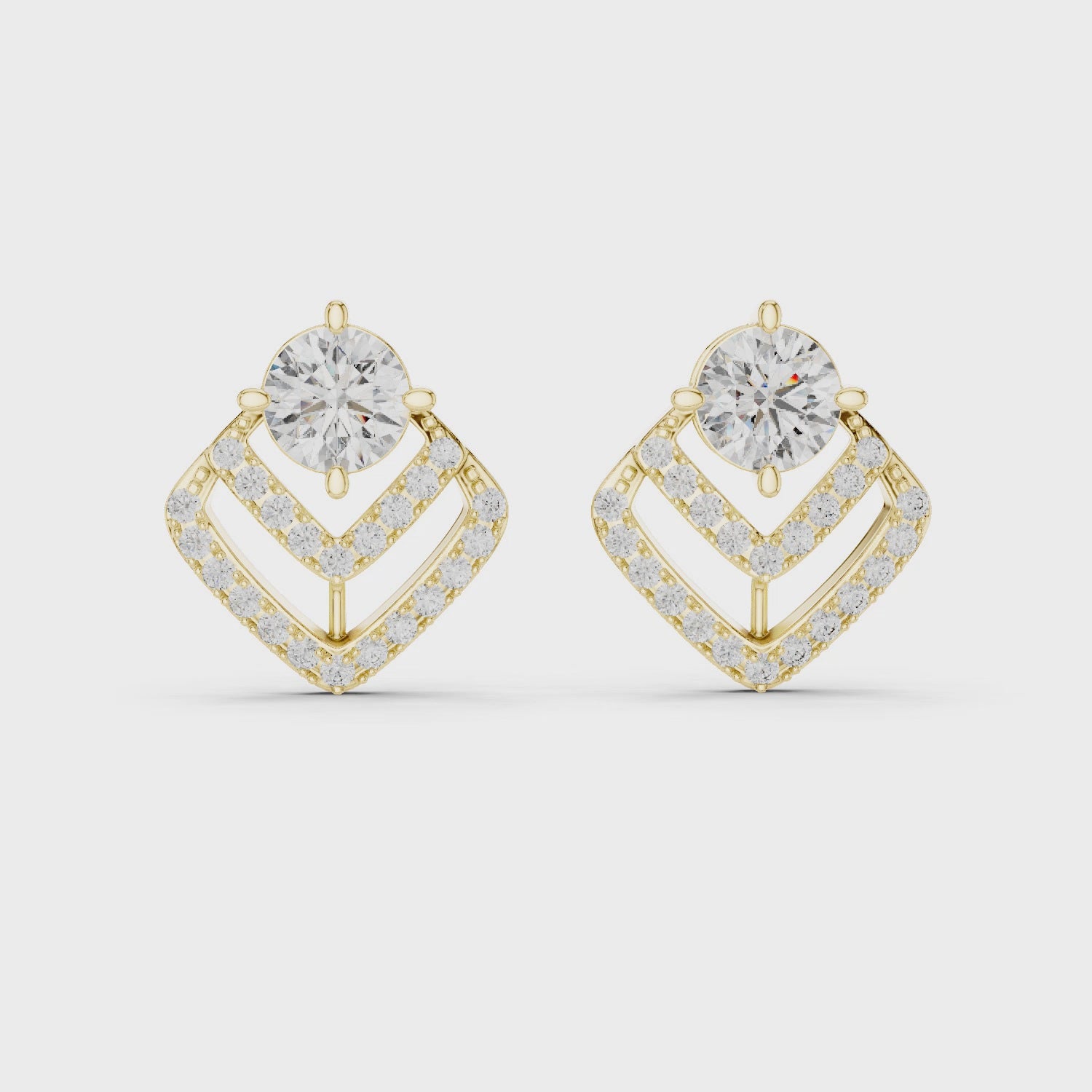 Gold earrings with diamonds on a white background