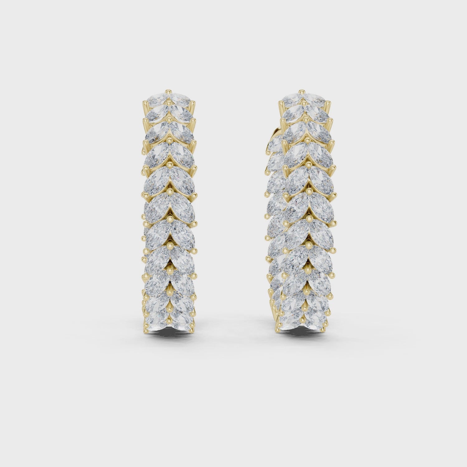 Pair of diamond hoop earrings on a white background