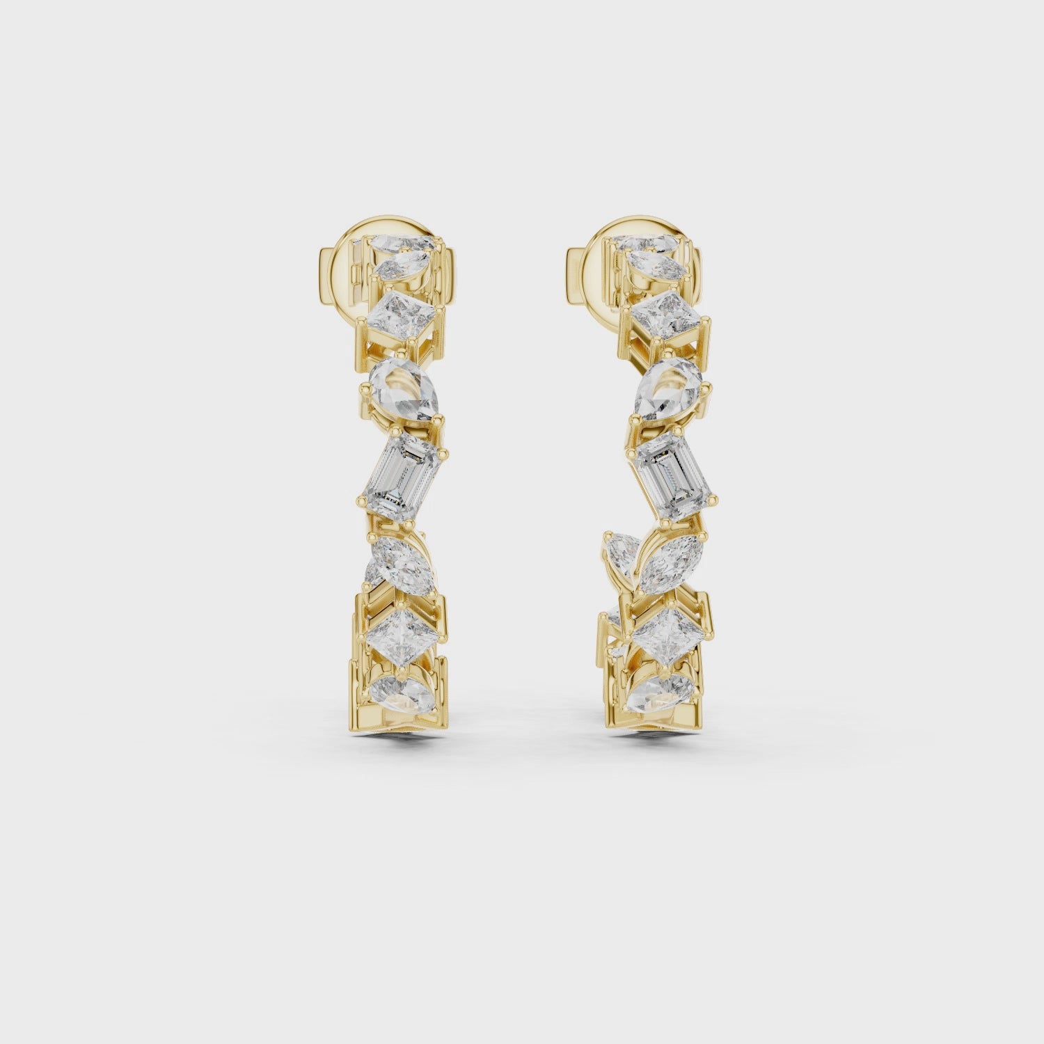 Gold earrings with diamonds on a white background