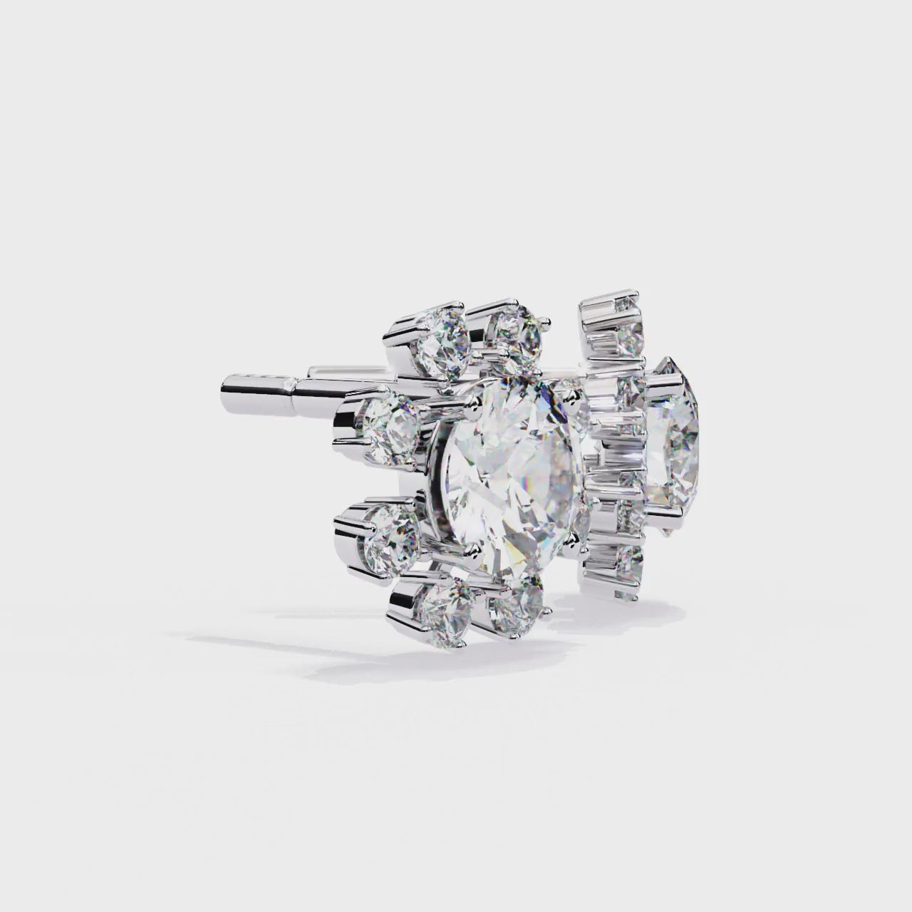 Pair of snowflake-shaped diamond earrings on a white background