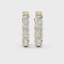 Gold hoop earrings with diamonds on a white background
