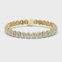 Gold bracelet with diamond accents on a white background