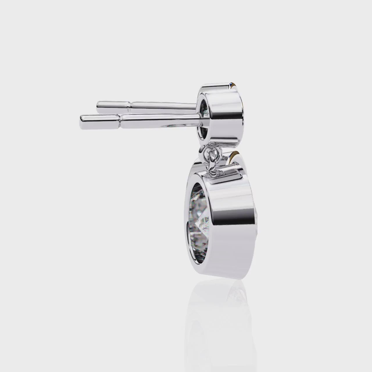 Silver earrings with large diamonds on a white background