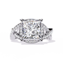 ring showcases a magnificent Princess-cut solitaire encircled by a shimmering Pavé halo