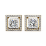 Pair of square-cut diamond earrings with gold frames on a white background