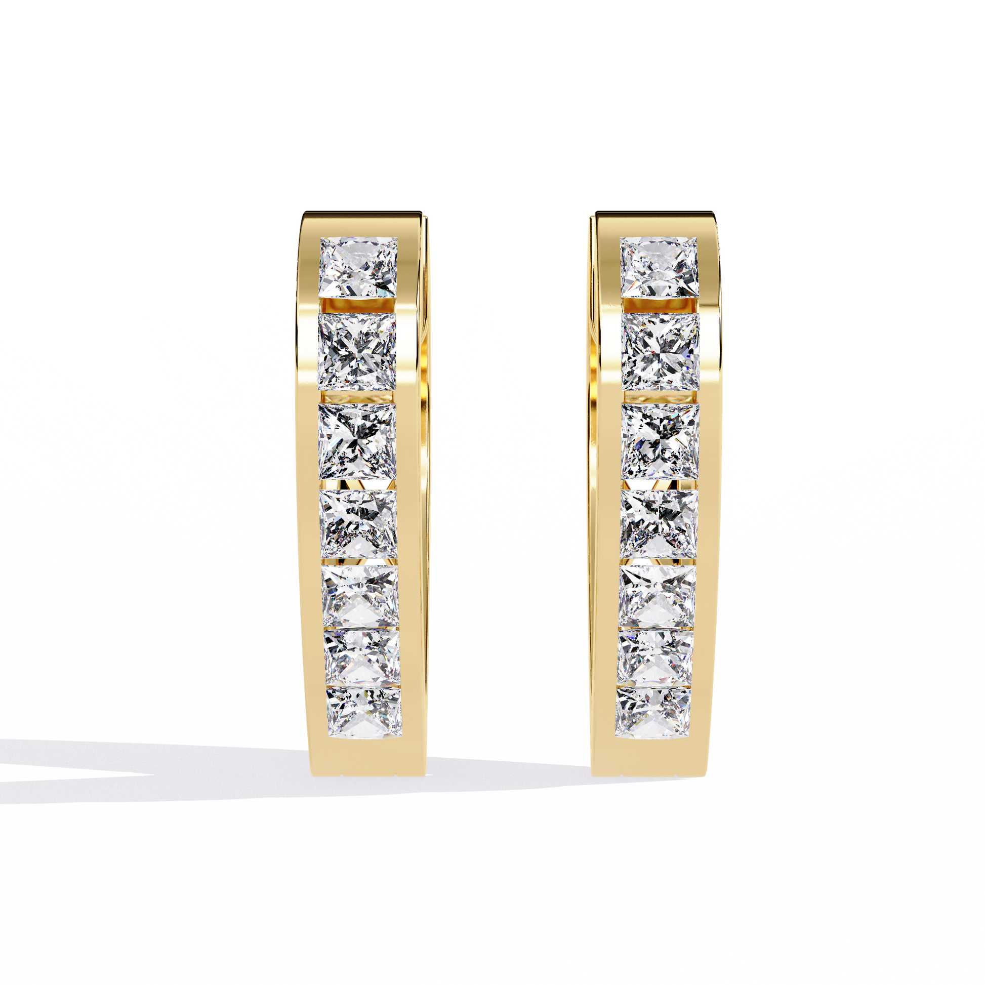 Gold hoop earrings with embedded diamonds on a white background