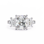 ring features a substantial Radiant-cut solitaire flanked by matching Radiant and Baguette-cut side stones