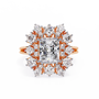 ring showcases a brilliant Radiant-cut diamond framed by an exquisite floral-inspired cluster halo