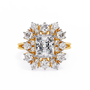 ring showcases a brilliant Radiant-cut diamond framed by an exquisite floral-inspired cluster halo