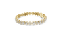 Gold bracelet with diamond accents on a white background