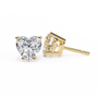Two diamond earrings, one heart-shaped and one square-cut, on a white background.