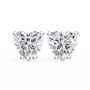 Heart-shaped diamond earrings on a white background