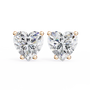 Heart-shaped diamond earrings on a white background