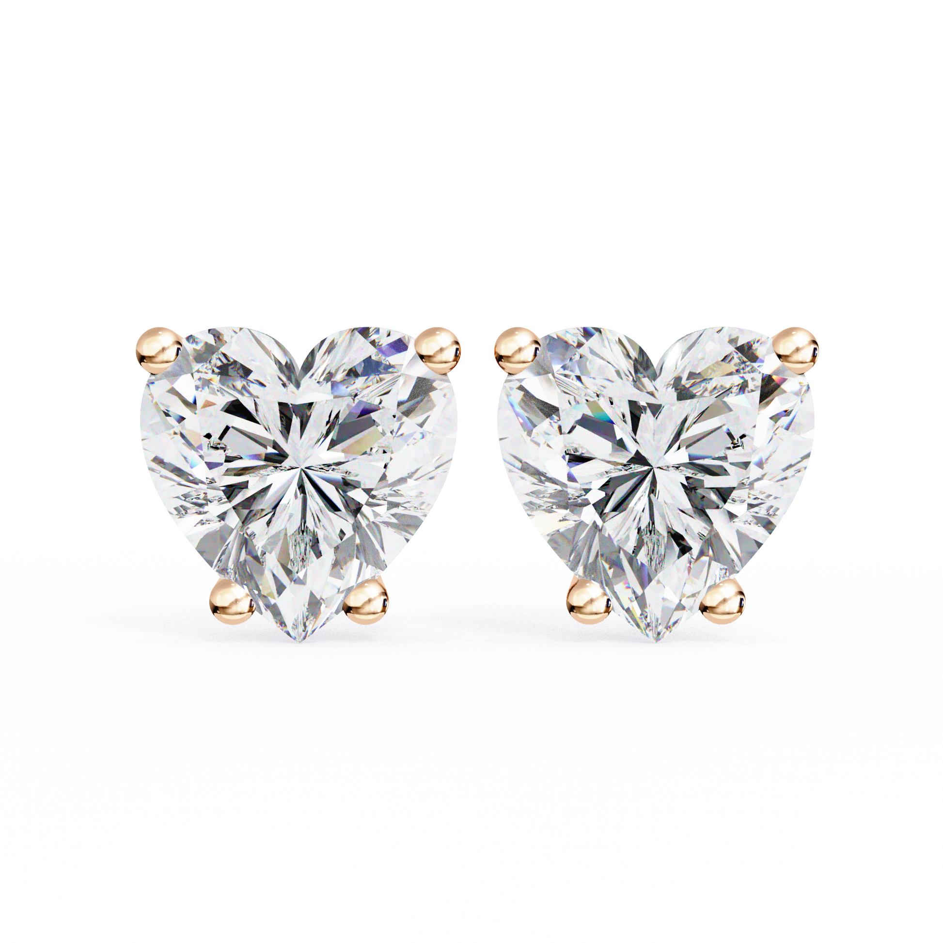 Heart-shaped diamond earrings on a white background