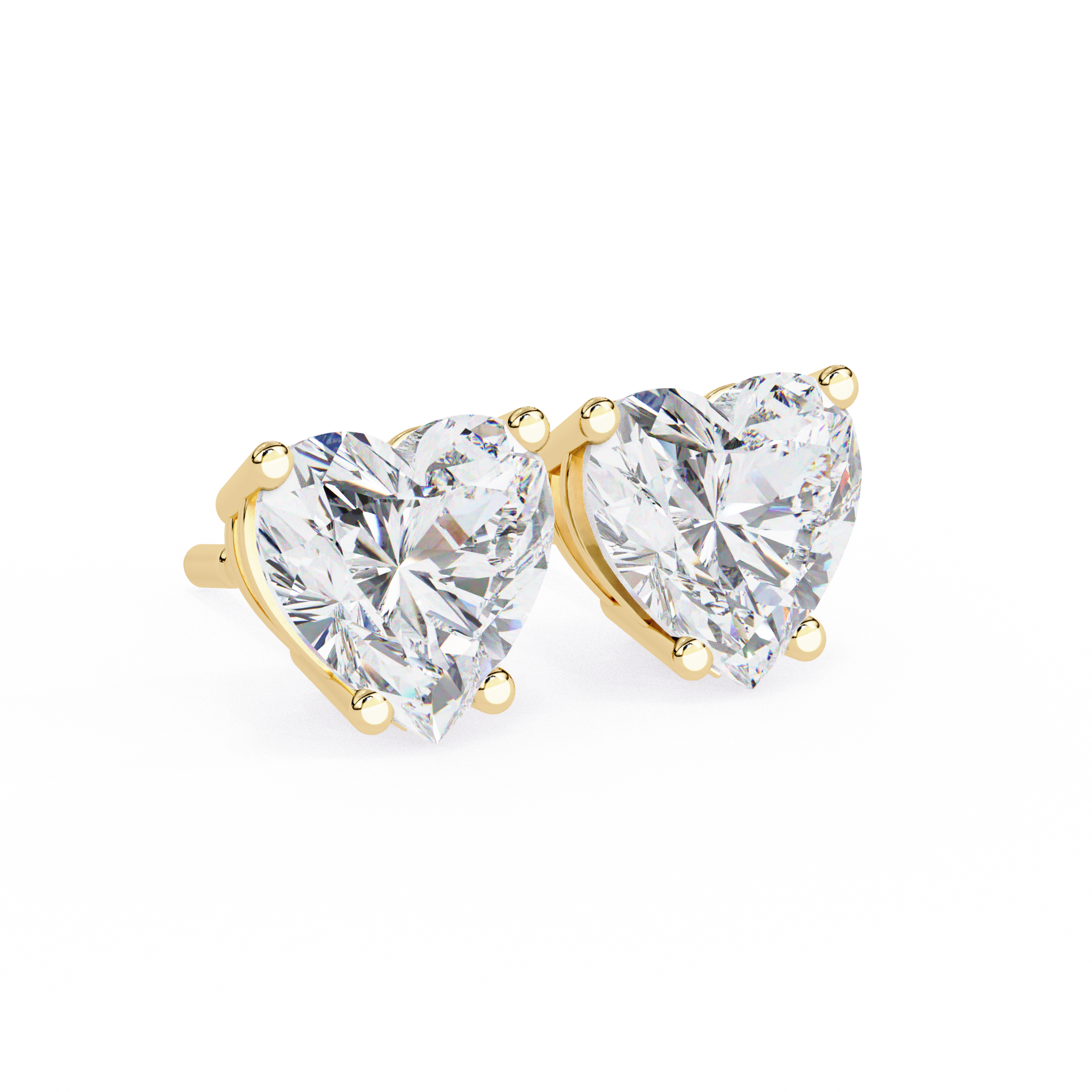 Heart-shaped diamond earrings with gold settings on a white background