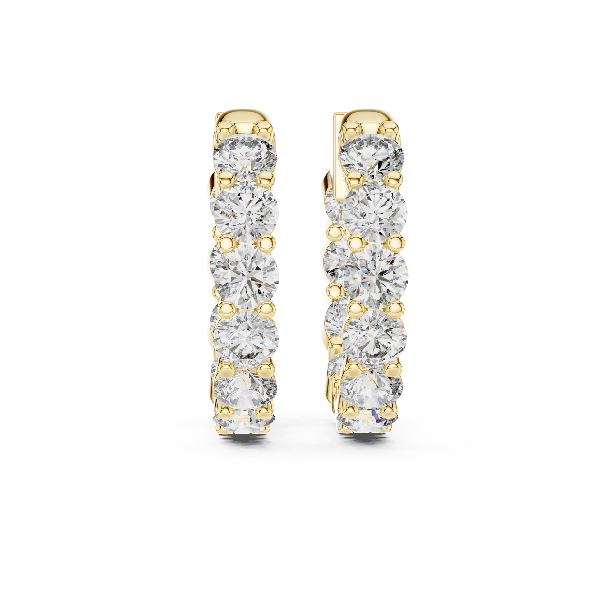 Gold hoop earrings with diamonds on a white background