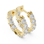 Gold hoop earrings with diamonds on a white background