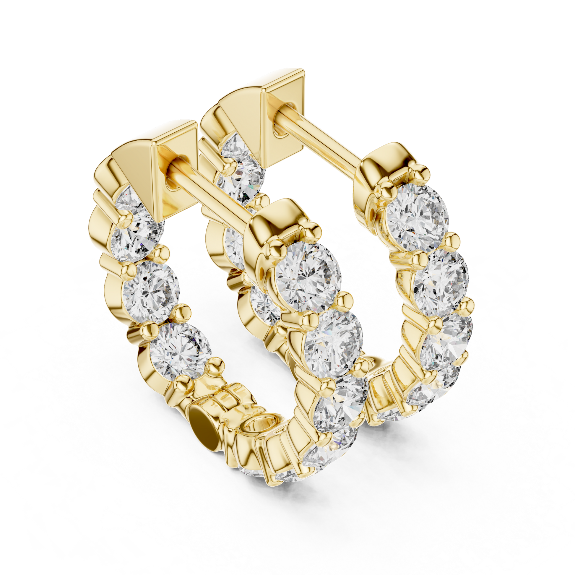 Gold hoop earrings with diamonds on a white background