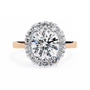 Features a brilliant Round Diamond centre framed by an oversized halo of shimmering accent diamonds