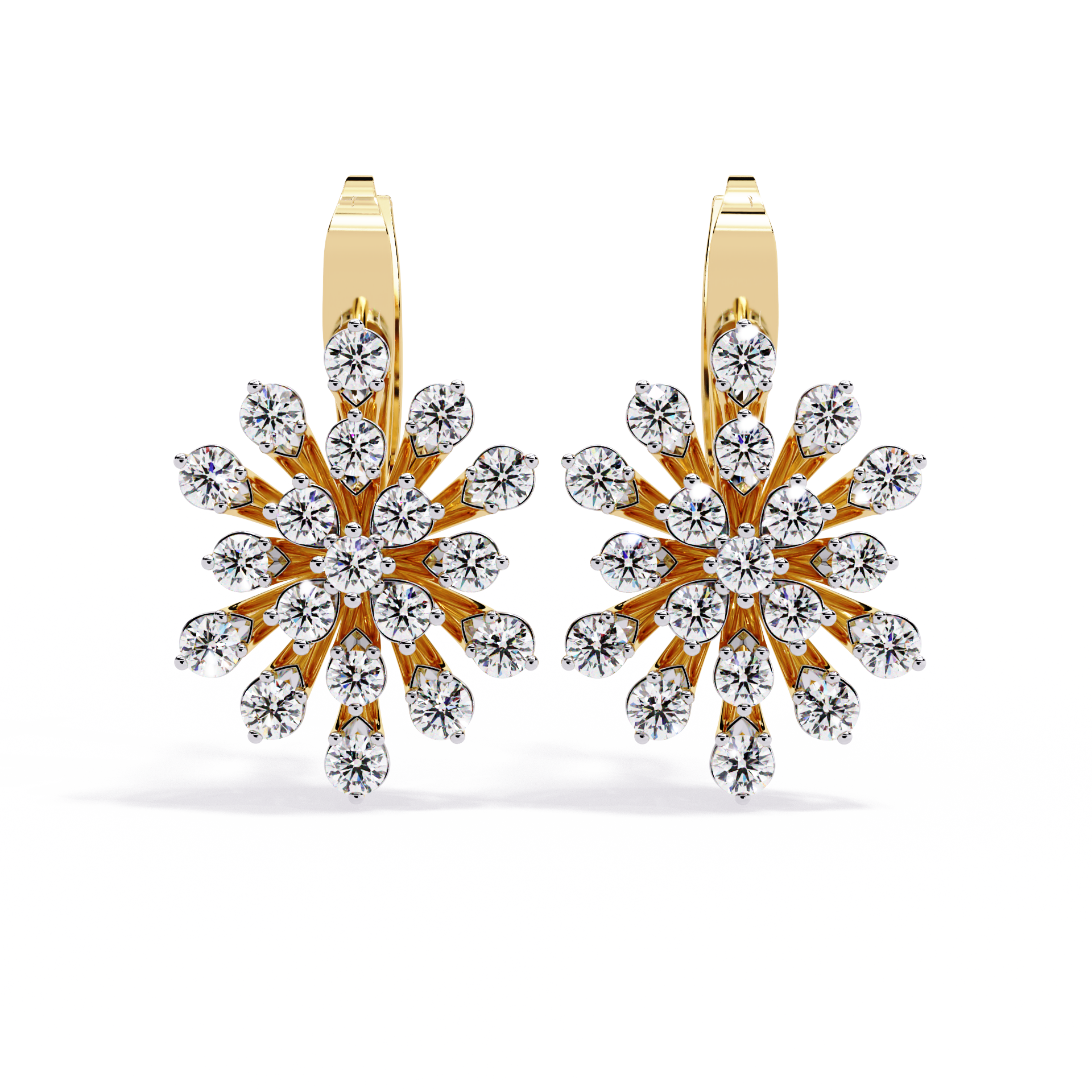 Gold and diamond snowflake earrings on a white background