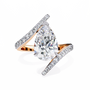 ring features a magnificent Pear diamond held within a sophisticated spiral-esque bypass band