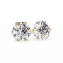 Pair of diamond stud earrings on a white background