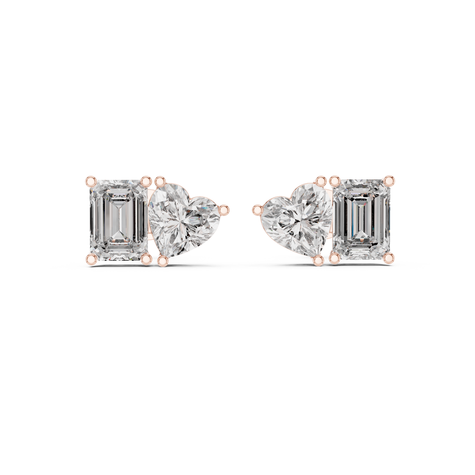 Diamond earrings with emerald-cut and heart-shaped stones on a white background