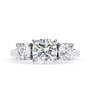 Cushion-cut solitaire flanked by two perfectly matched cushion-cut side stones