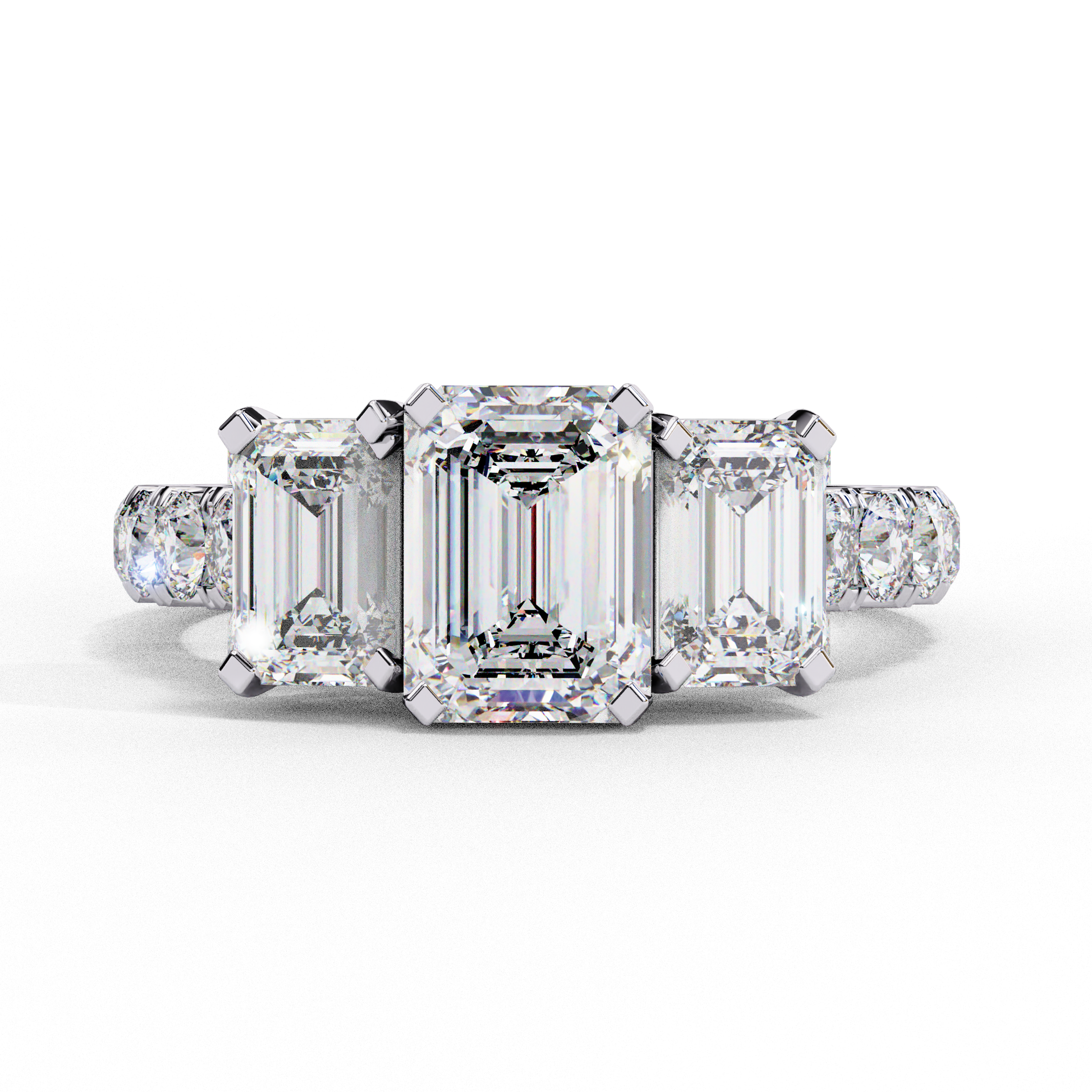 ring showcases a substantial Emerald-cut solitaire flanked by two perfectly matched emerald-cut side stones