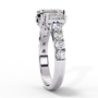 ring showcases a substantial Emerald-cut solitaire flanked by two perfectly matched emerald-cut side stones