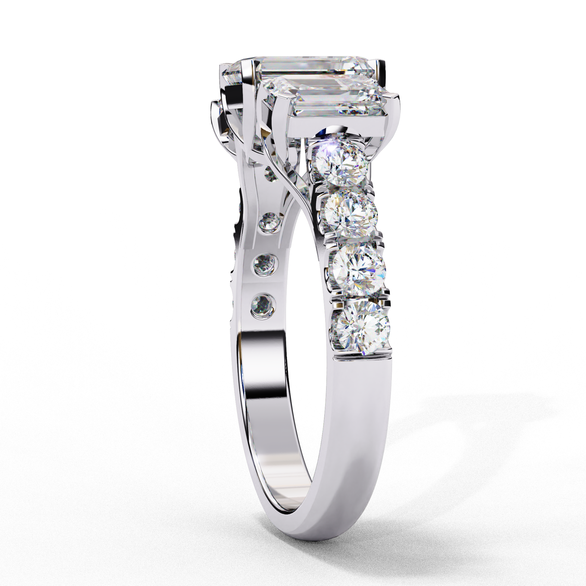 ring showcases a substantial Emerald-cut solitaire flanked by two perfectly matched emerald-cut side stones