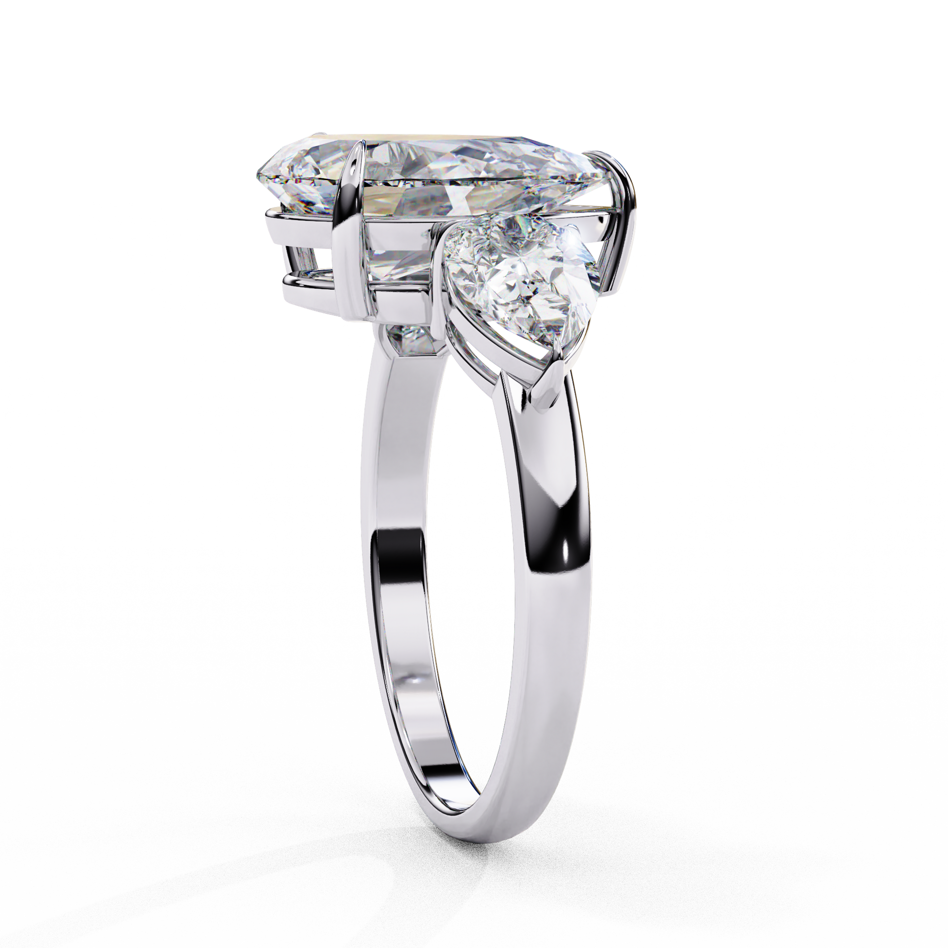 trilogy ring showcases a substantial Pear centre flanked by two perfectly matched pear-shaped side stones