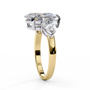 trilogy ring showcases a substantial Pear centre flanked by two perfectly matched pear-shaped side stones