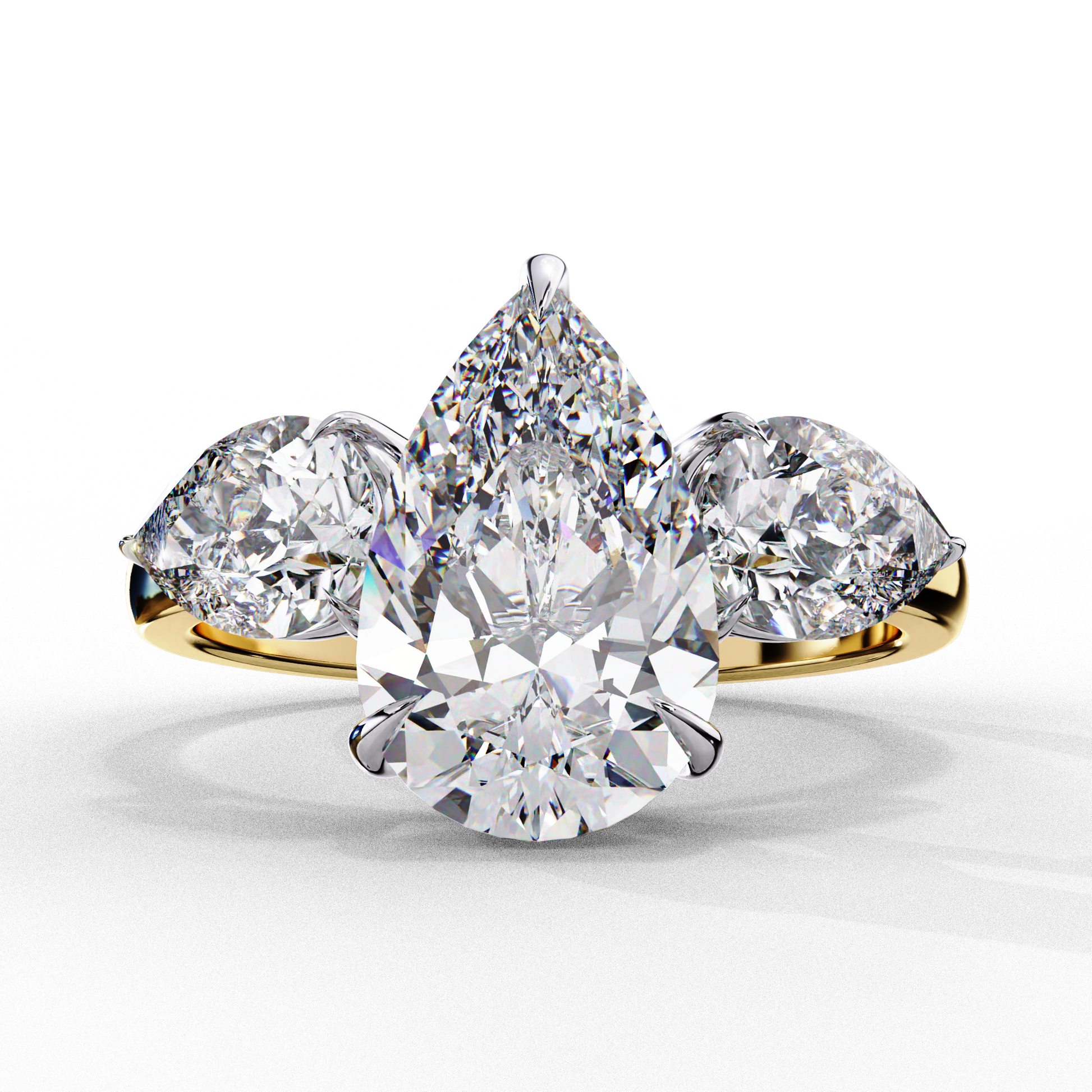 Diamond ring with three pear-shaped diamonds on a white background