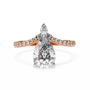 features a Pear-shaped diamond centre set atop a modern V-contoured band, which terminates in a delicate accent pear diamond tail