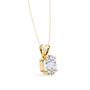 Gold necklace with a diamond pendant on a white background